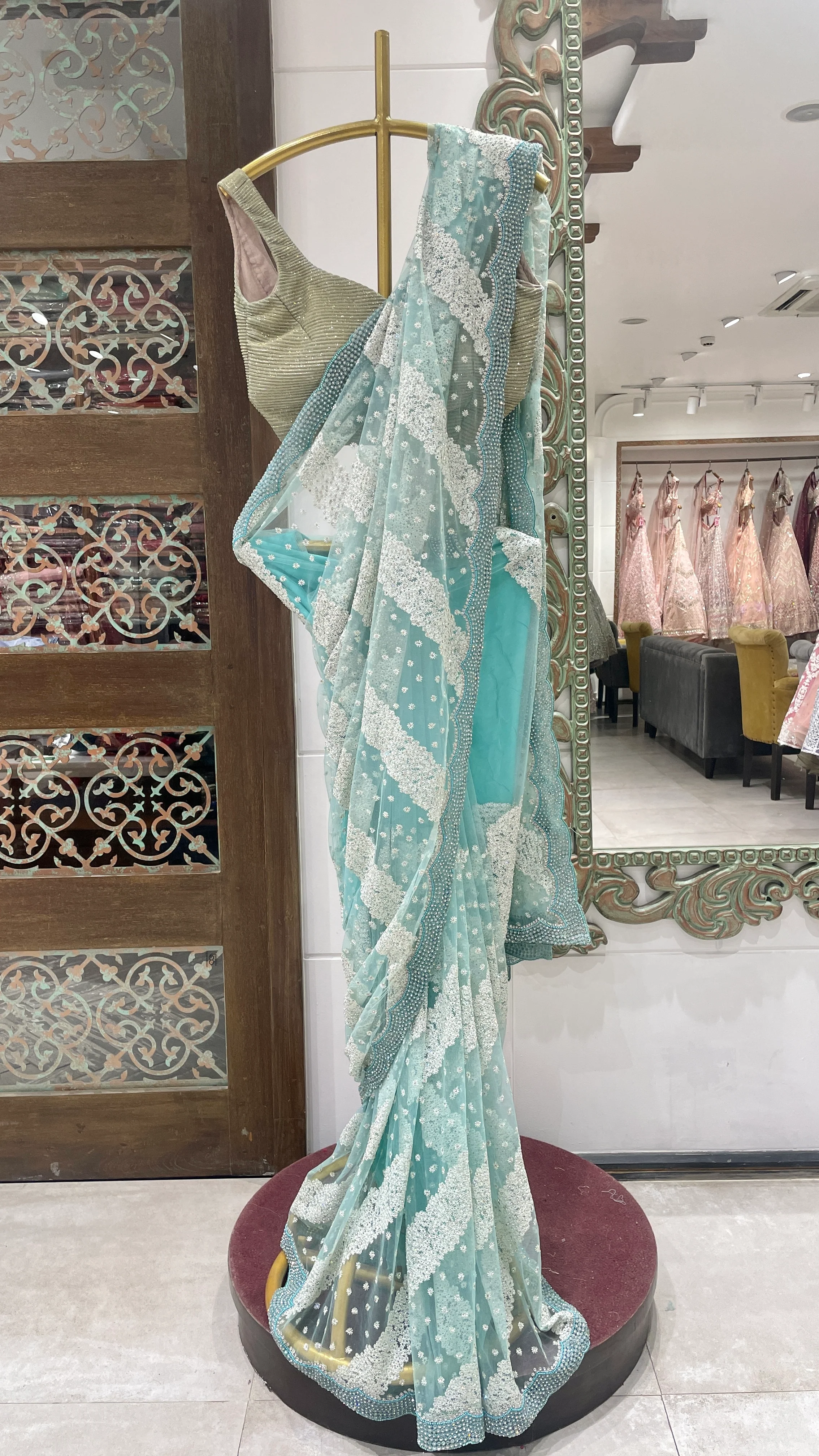 Blue net saree with floral motifs