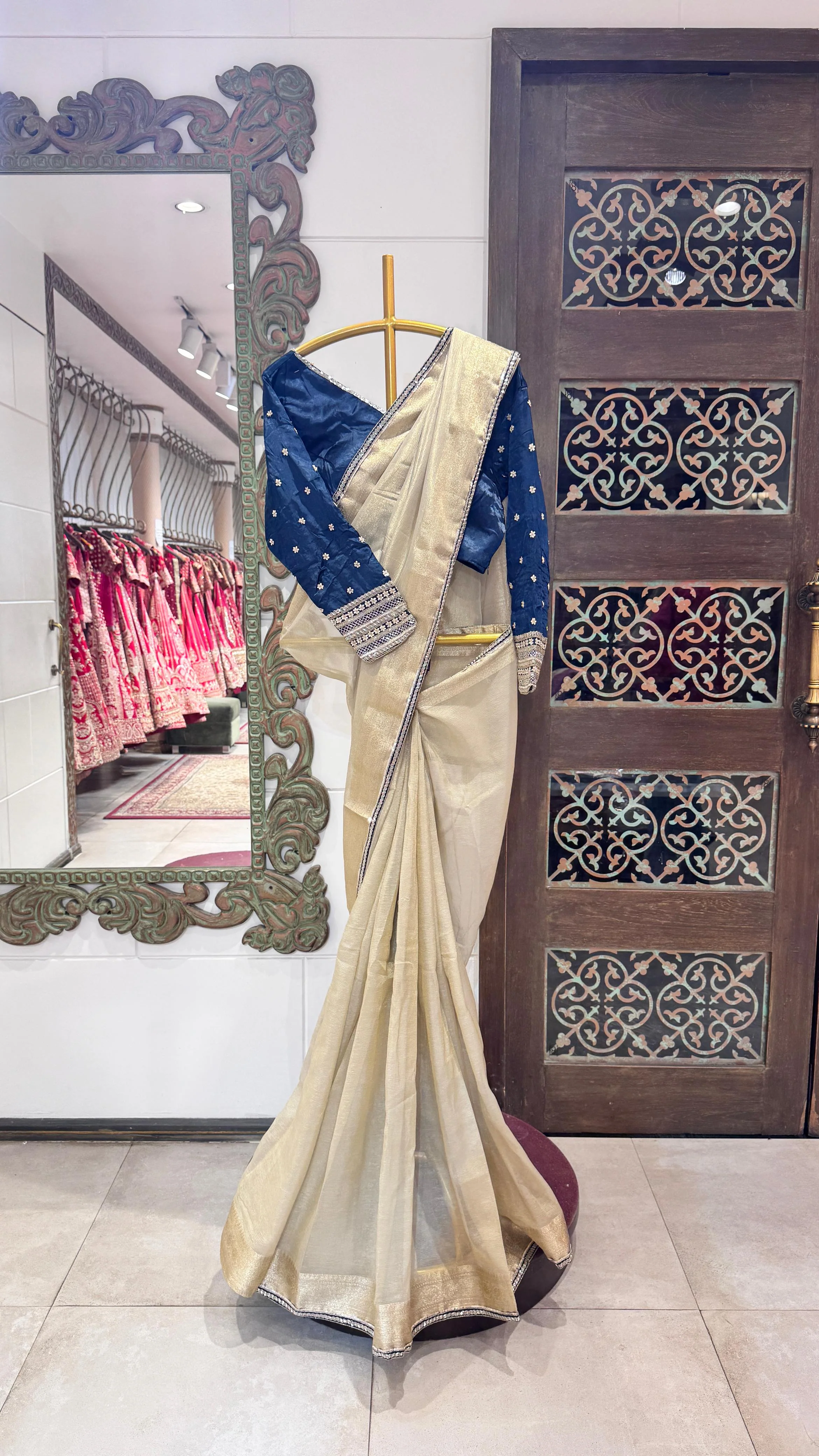 Gold color saree with zig-zag sequience border