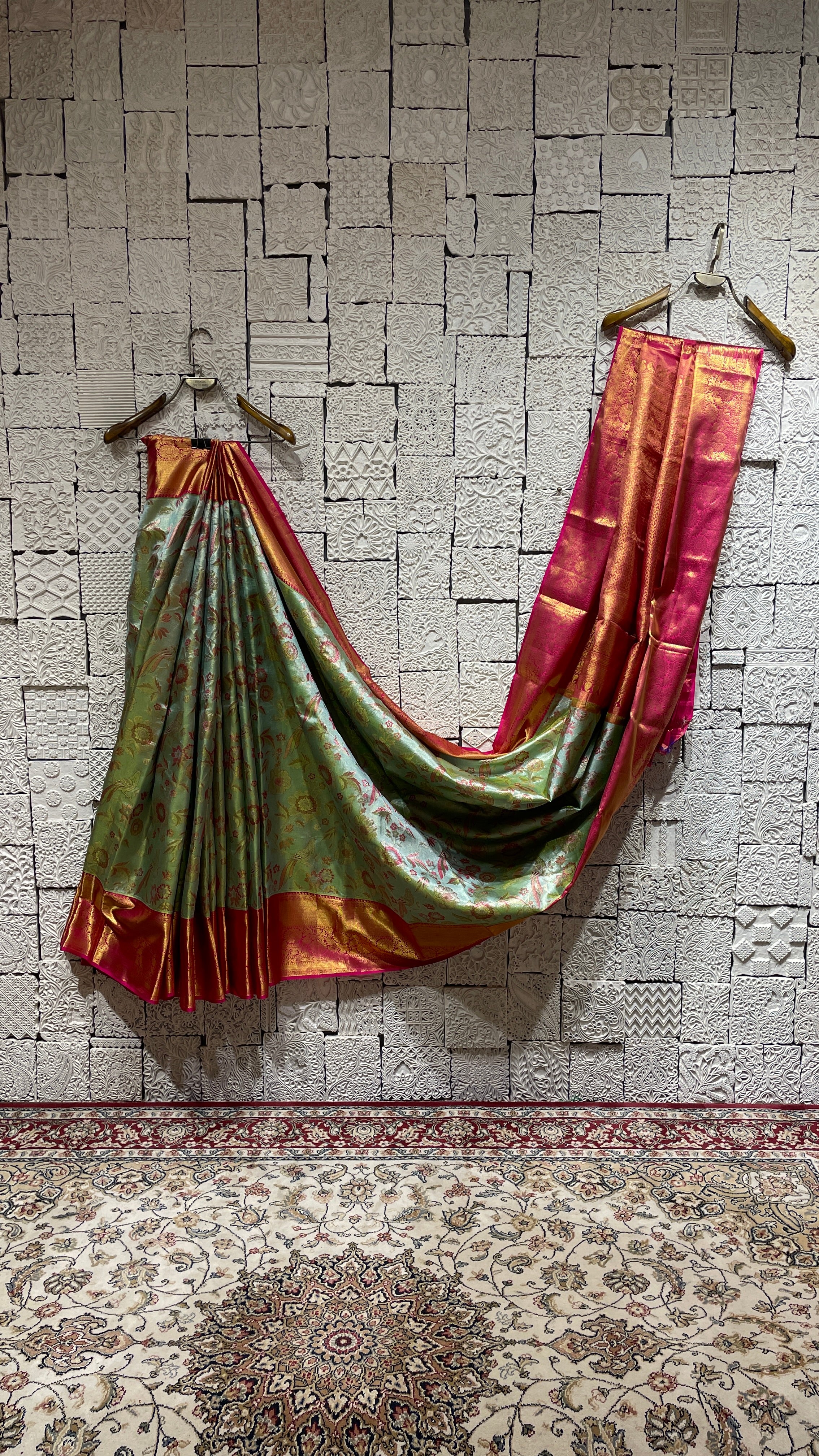 Green silk Kanjivaram saree with pink border