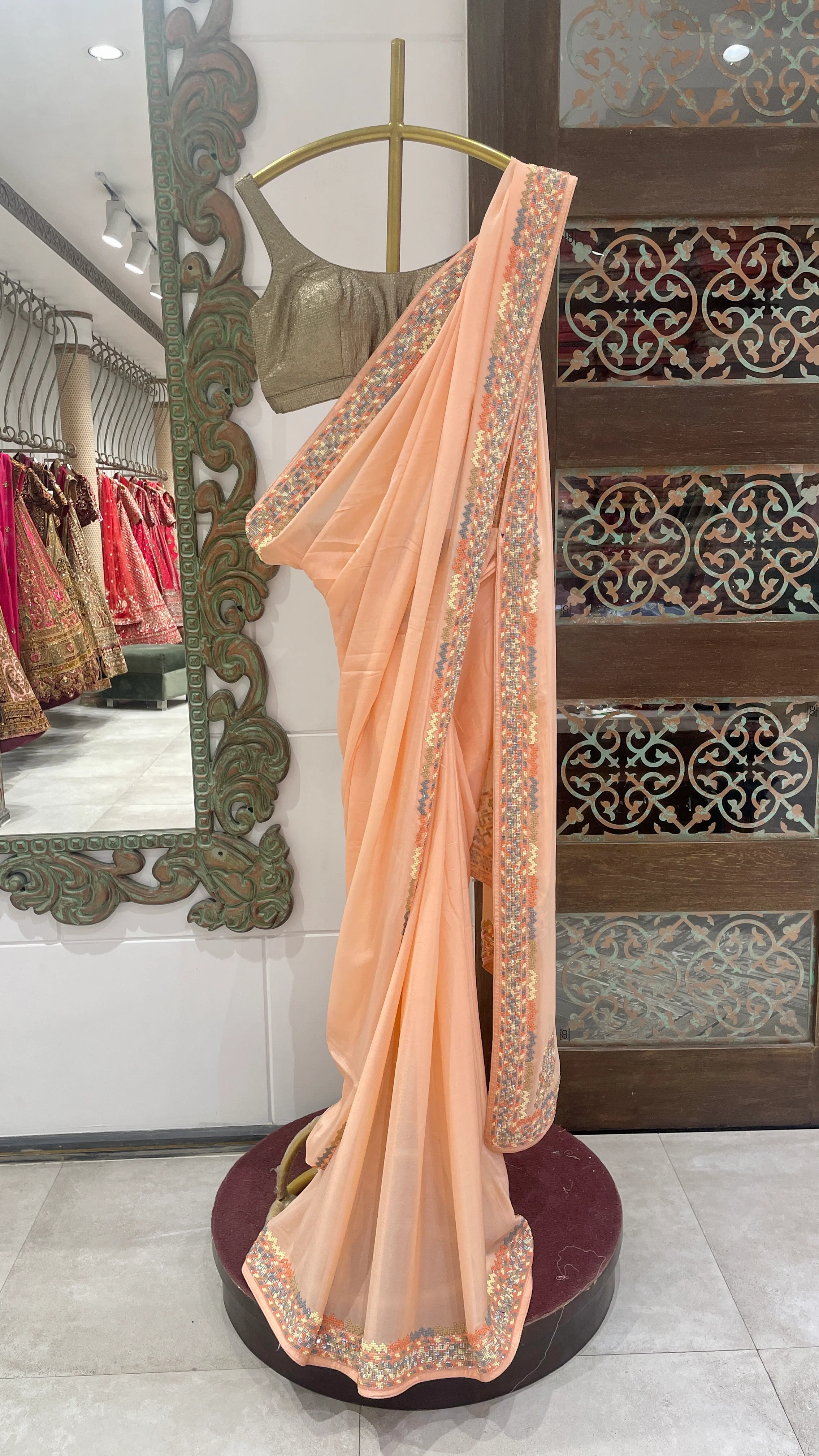 Peach Saree with Multicolor Embellished Border and Golden Blouseshments