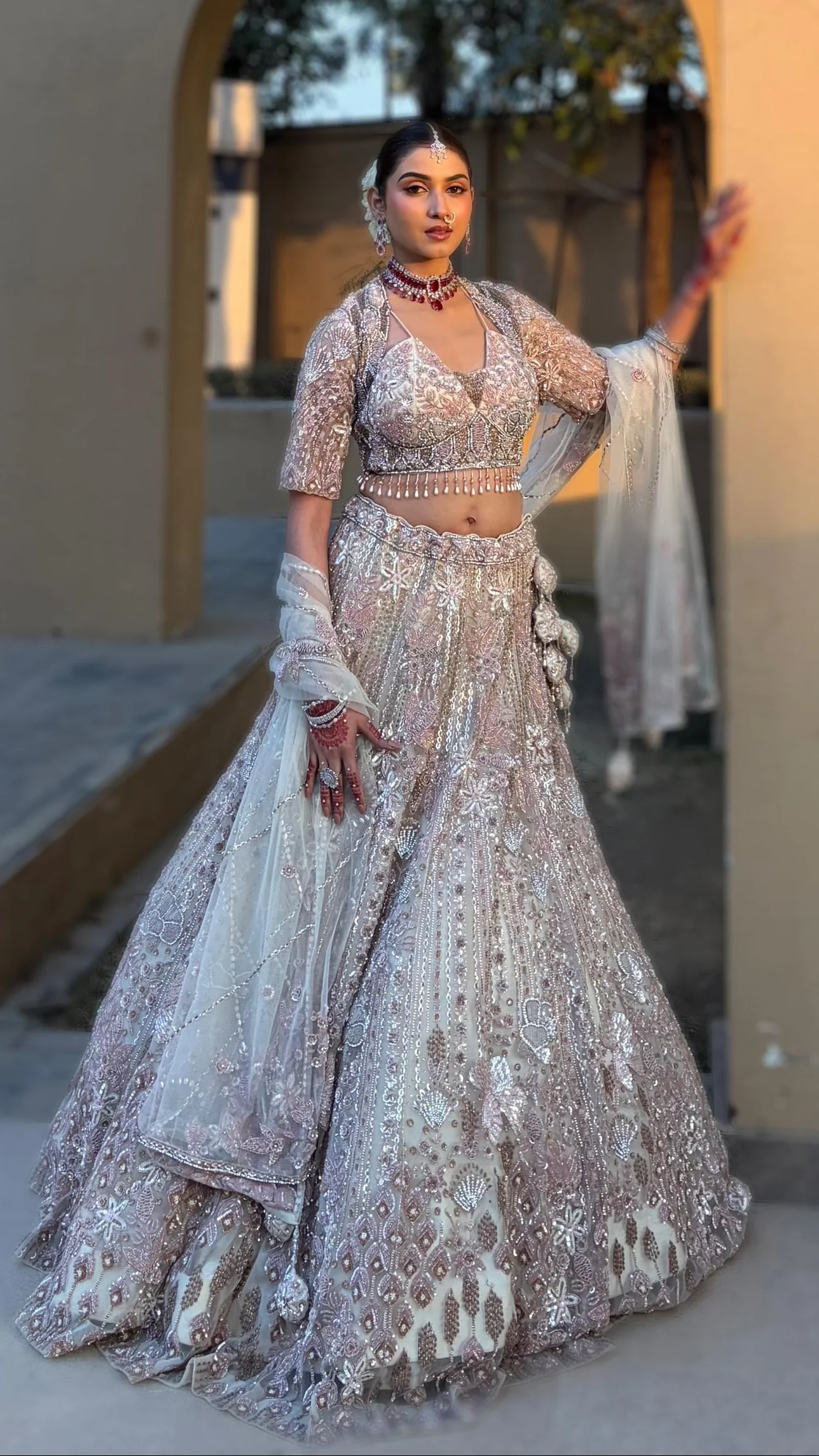 Pink & cream net lehenga with Floral embellishments