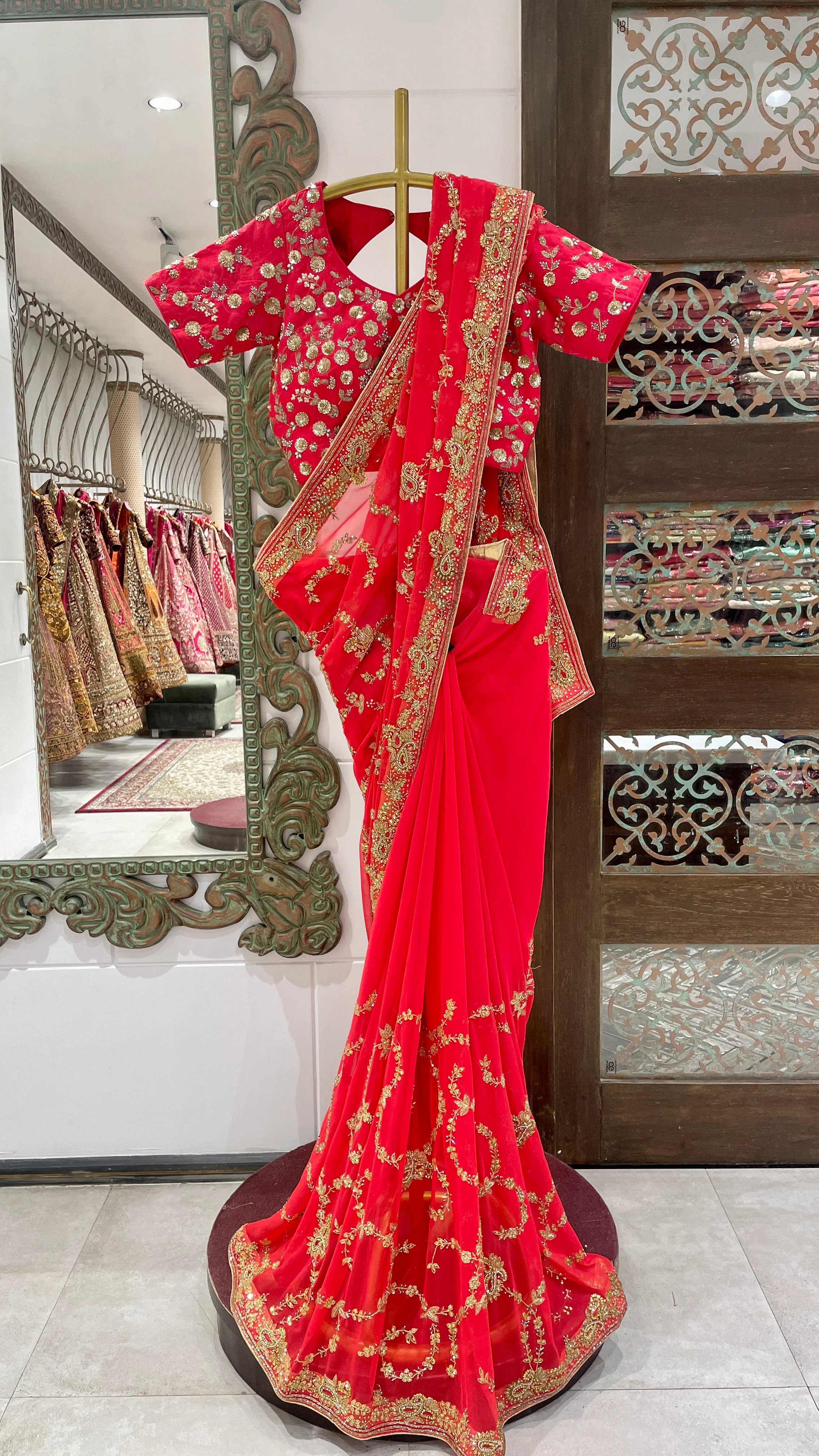 Red Saree with Golden Embroidery and Embellished Blouse